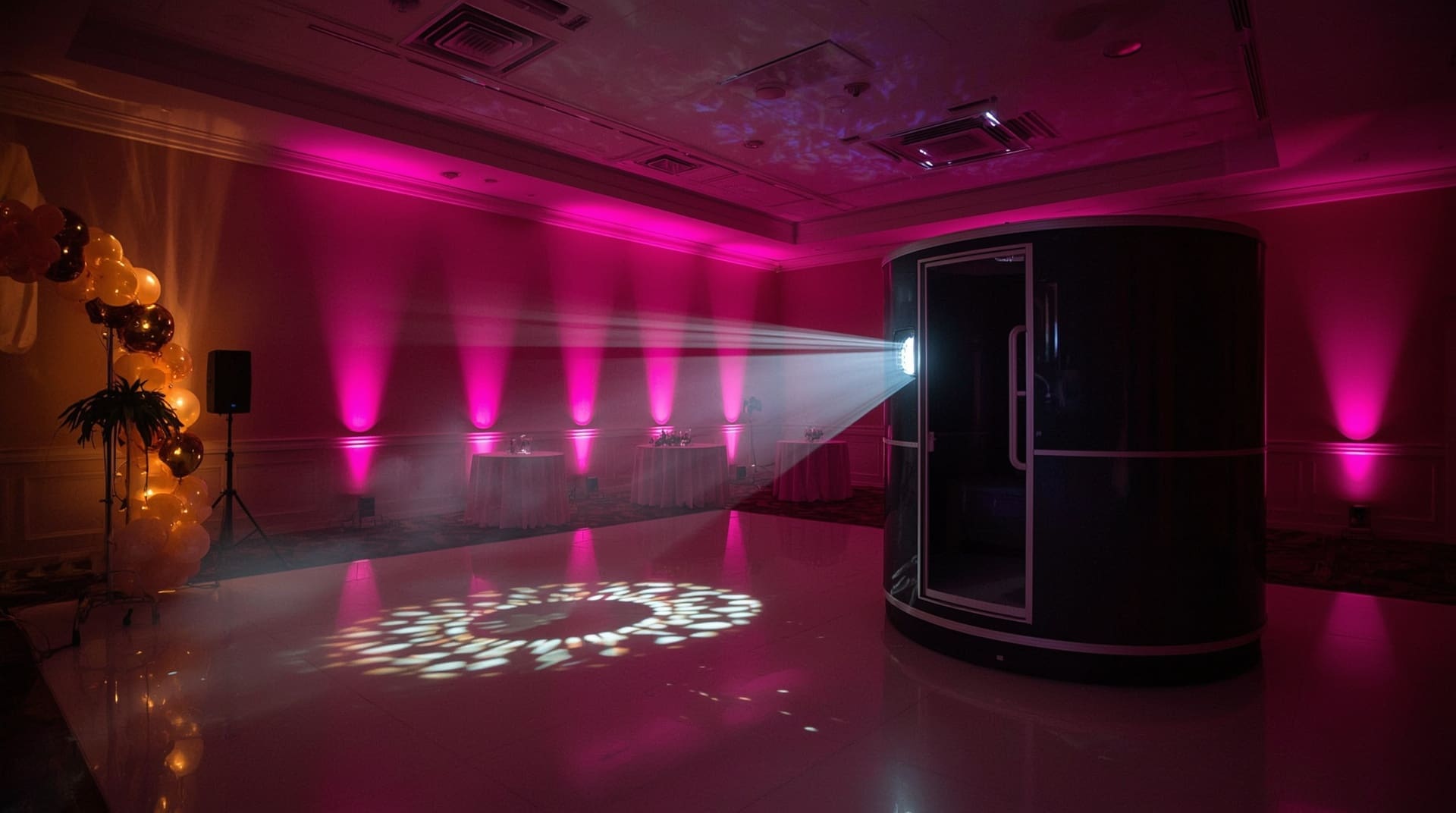 Prom venue with 360 photo booth uplighting fog effects and gobo dance floor projection